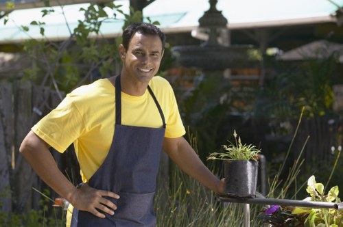 Gardener carrying out a safe site inspection before starting work