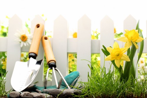 Professional gardener using protective equipment during maintenance tasks